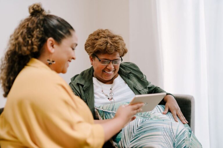 Two women looking at a tablet