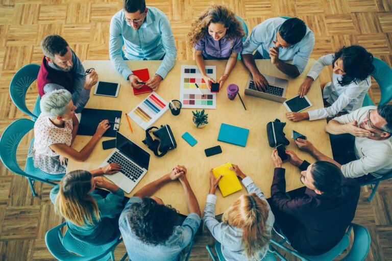 High angle view of workers sitting in a circle having a meeting